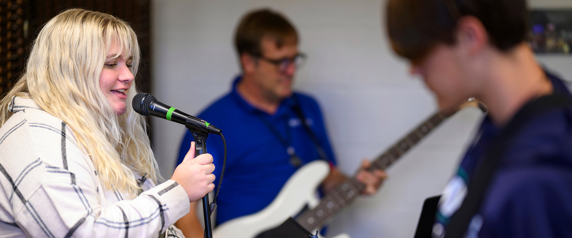 Band practicing instruments and singing