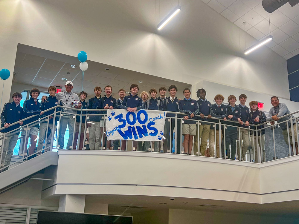 Soccer team with 300 wins banner in the Wilson Center